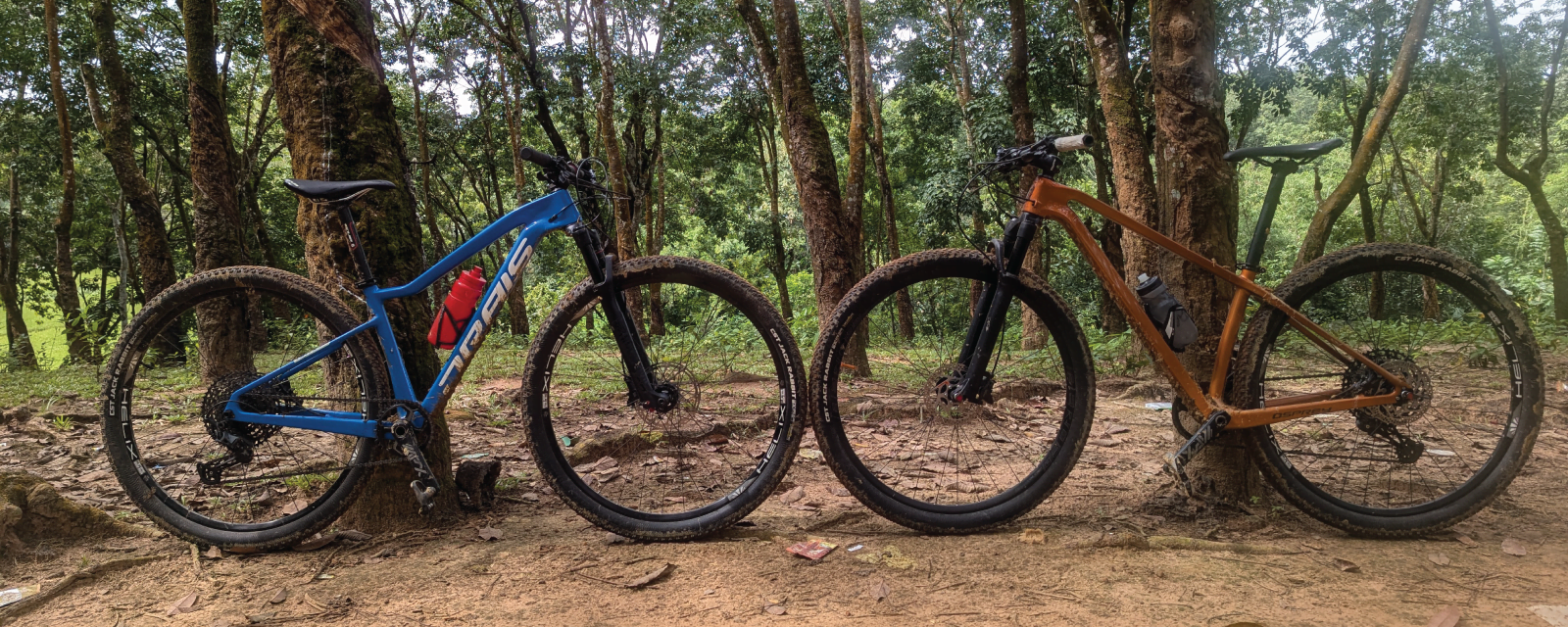 Cyclists riding cross country bikes on a trail